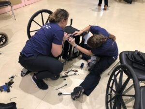 HSU physical therapy students customize a wheelchair for their patient.