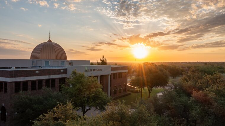 Sun rising on campus, over the Skiles building.