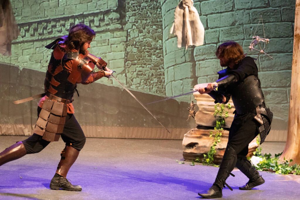 HSU Theatre performing Macbeth: Two students acting out a scene with swords