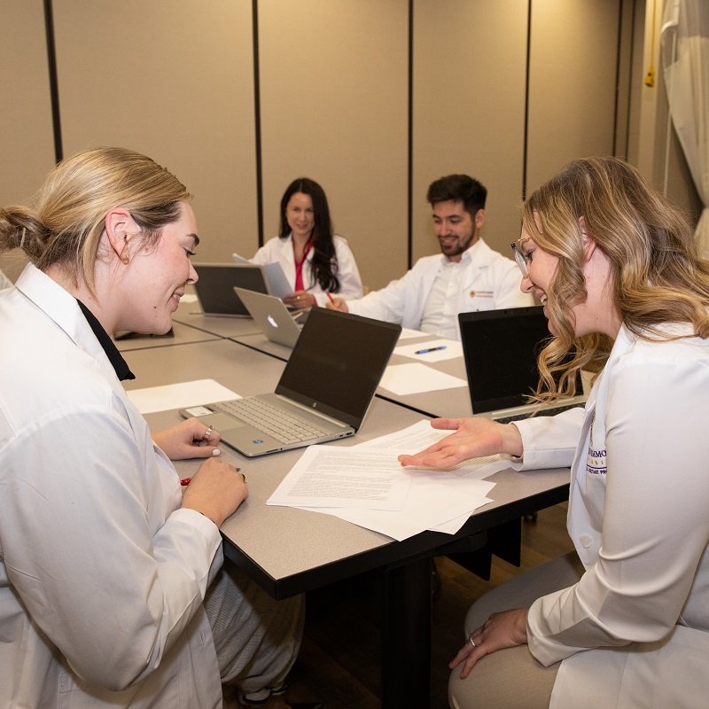 PA students studying around a table.