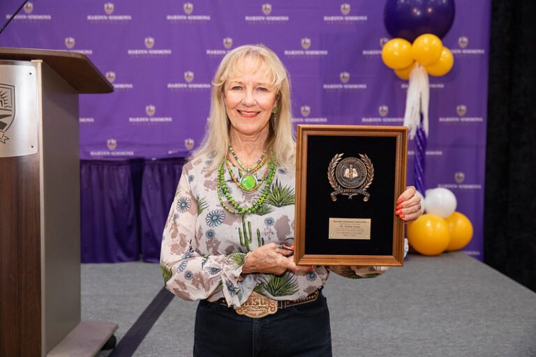 Debbie Jones holds her award.