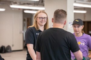 Gabby Bognich works with students at HSU.