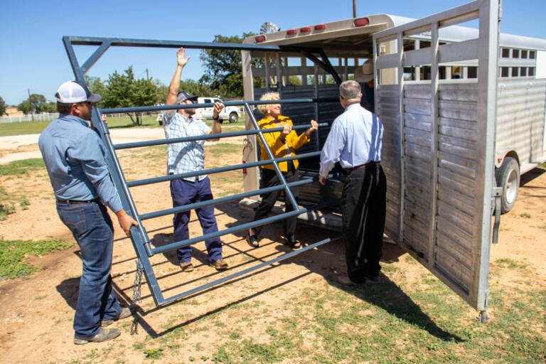 HSU Faculty and Staff at the horse barn unloading equipment