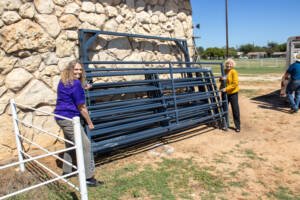 HSU Faculty and Staff at the horse barn unloading equipment