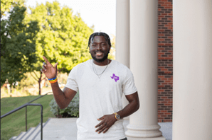 Christlieb Scholarship recipient, Cedric, posing on campus